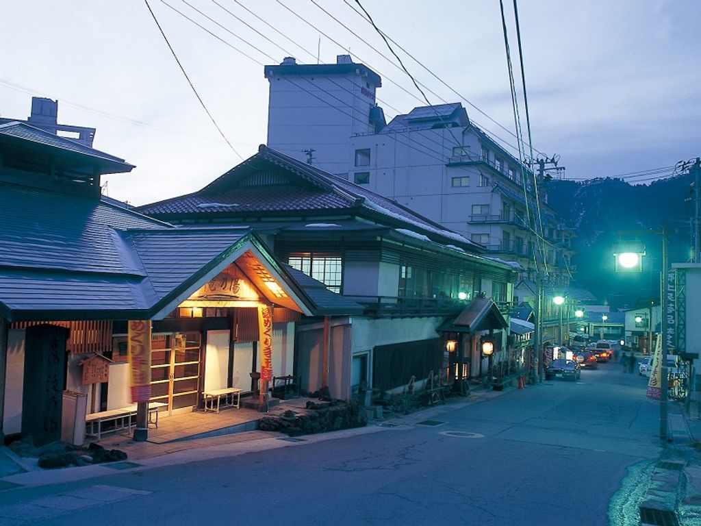 The onsen lit up during twilight. A nostalgic sight of an onsen town in Japan. 